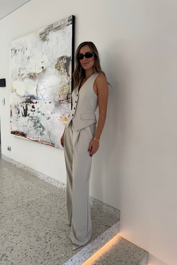 Marlie Tailored Vest Stone by Sneaky Link – Sharp, structured vest in a premium poly-viscose blend with a button front. Perfect paired with Marlie Pant. Dry clean only.