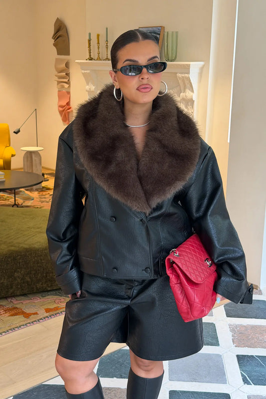 Jaz Faux Fur Collar Jacket in Black with a structured leather look finish and oversized fur collar, creating a bold silhouette that can be worn sleek or elevated.