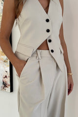 Marlie Tailored Vest Stone by Sneaky Link – Sharp, structured vest in a premium poly-viscose blend with a button front. Perfect paired with Marlie Pant. Dry clean only.
