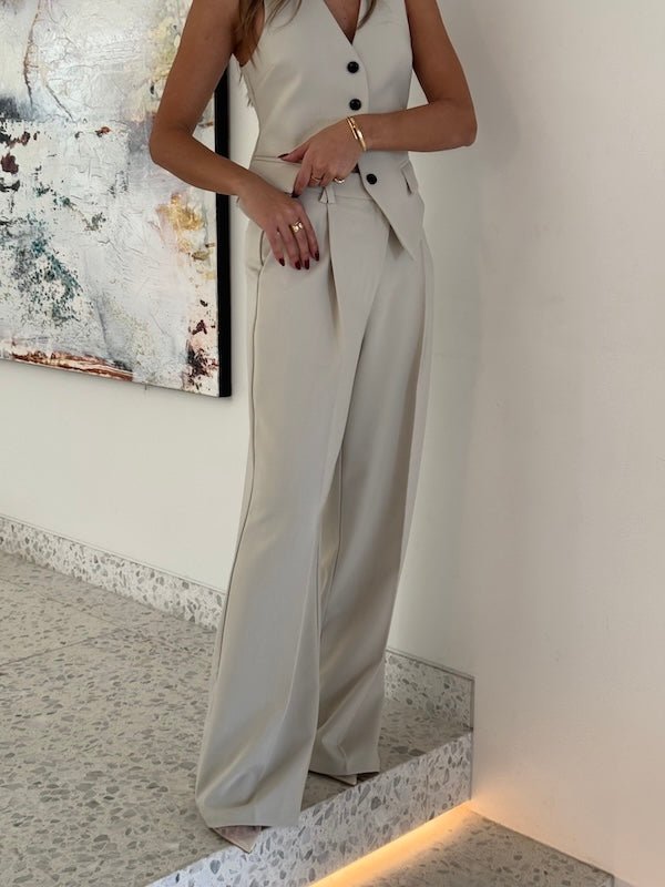 Marlie Pant Stone by Sneaky Link, high-waisted, straight-leg tailored pants in a soft viscose-poly blend. Features flattering waist tuck, crossed belt loops, and delicate embroidery. Cold hand wash.