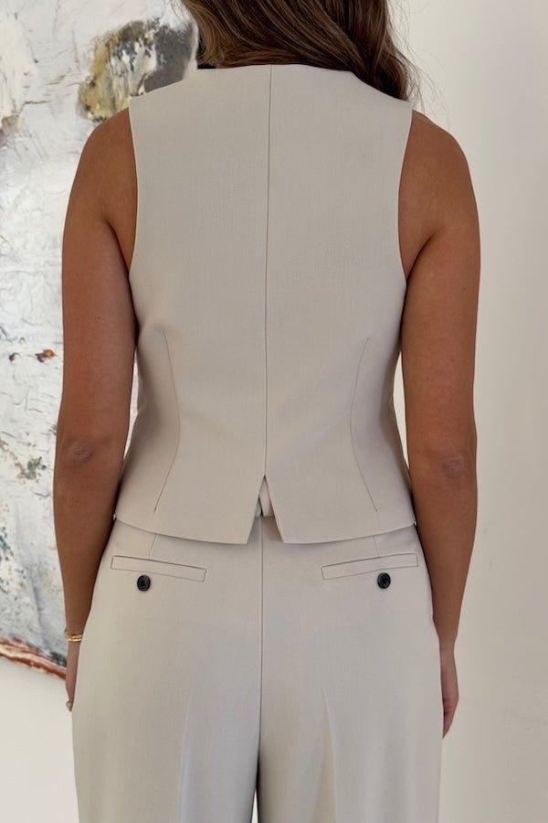 Marlie Tailored Vest Stone by Sneaky Link – Sharp, structured vest in a premium poly-viscose blend with a button front. Perfect paired with Marlie Pant. Dry clean only.