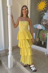 Tiered Maxi Dress Lemon/Gold by D'Artemide – Cotton strapless dress with ruffle layers and bandeau top for a flattering fit.