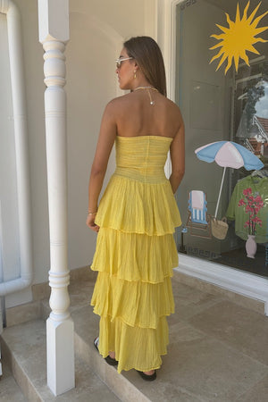 Tiered Maxi Dress Lemon/Gold by D'Artemide – Cotton strapless dress with ruffle layers and bandeau top for a flattering fit.