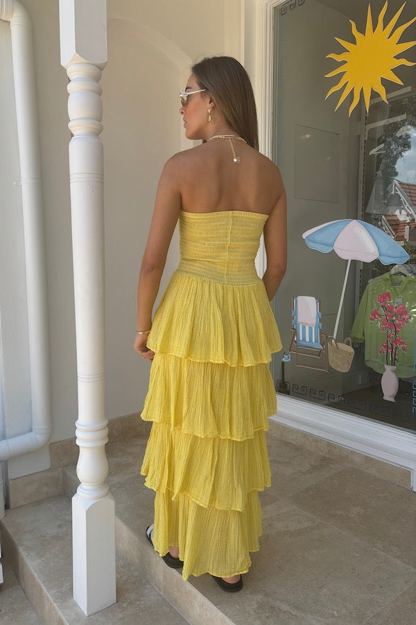 Tiered Maxi Dress Lemon/Gold by D'Artemide – Cotton strapless dress with ruffle layers and bandeau top for a flattering fit.