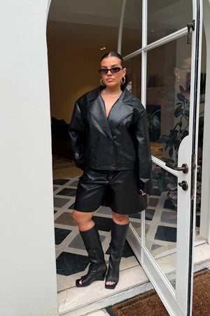 Jaz Faux Fur Collar Jacket in Black with a structured leather look finish and oversized fur collar, creating a bold silhouette that can be worn sleek or elevated.