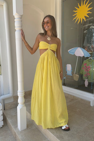 Chloe Dress Lemon by D'Artemide – Cotton strapless dress with ruched back, maxi skirt, side split, and low back detail.