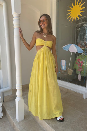 Chloe Dress Lemon by D'Artemide – Cotton strapless dress with ruched back, maxi skirt, side split, and low back detail.