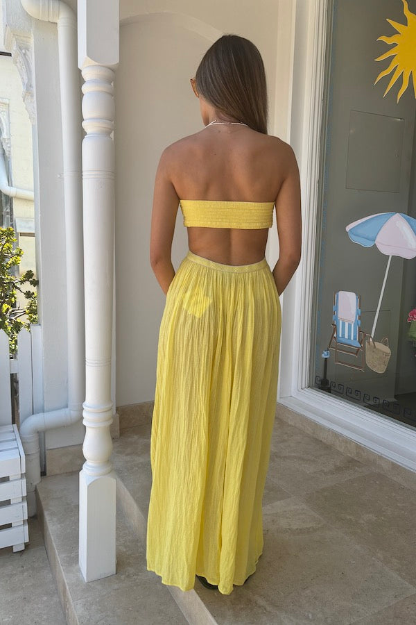 Chloe Dress Lemon by D'Artemide – Cotton strapless dress with ruched back, maxi skirt, side split, and low back detail.