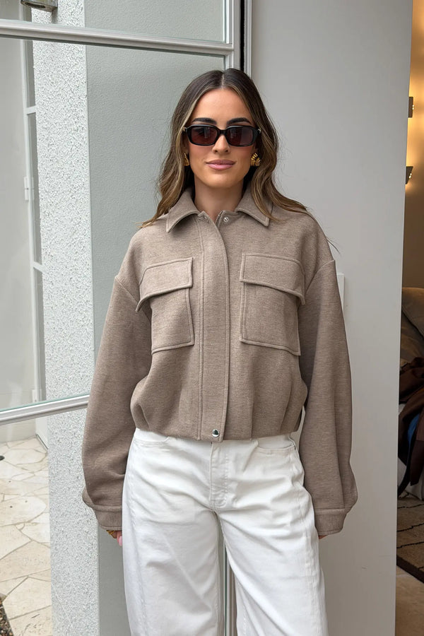 Jaz Lounge Bomber Jacket in oat marle color with ribbed cuffs and collar, front zipper, and relaxed fit.