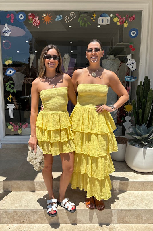 Tiered Maxi Dress Lemon/Gold by D'Artemide – Cotton strapless dress with ruffle layers and bandeau top for a flattering fit.