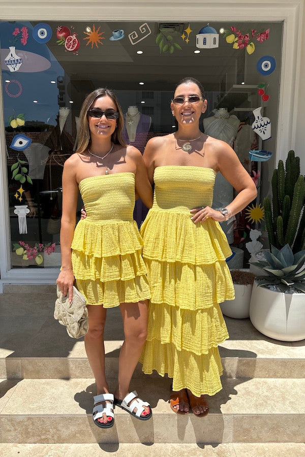Tiered Maxi Dress Lemon/Gold by D'Artemide – Cotton strapless dress with ruffle layers and bandeau top for a flattering fit.