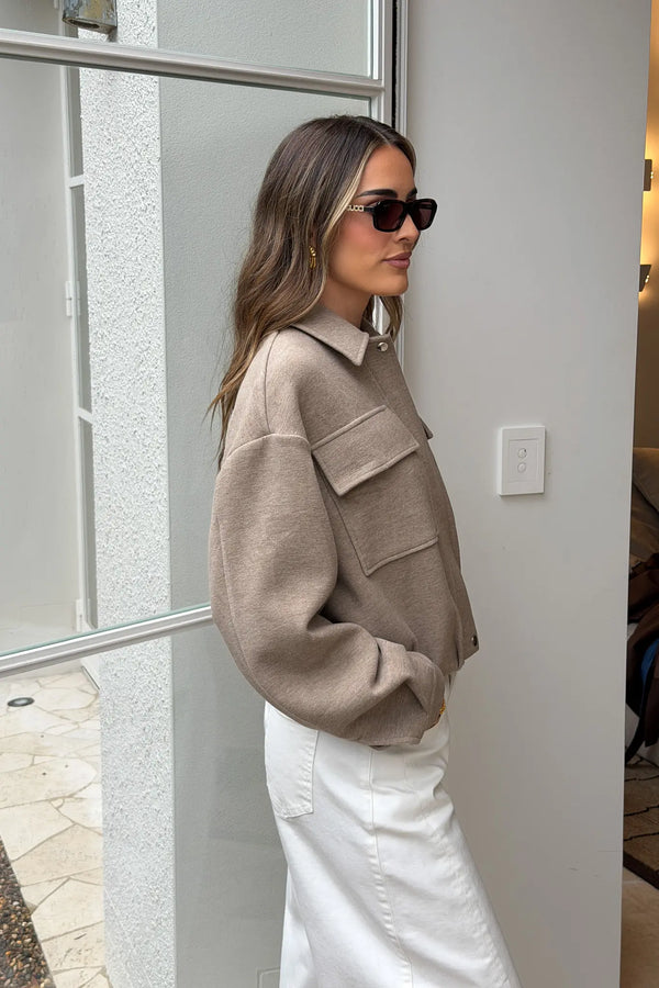 Jaz Lounge Bomber Jacket in oat marle color with ribbed cuffs and collar, front zipper, and relaxed fit.