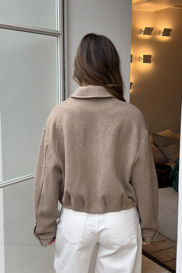 Jaz Lounge Bomber Jacket in oat marle color with ribbed cuffs and collar, front zipper, and relaxed fit.