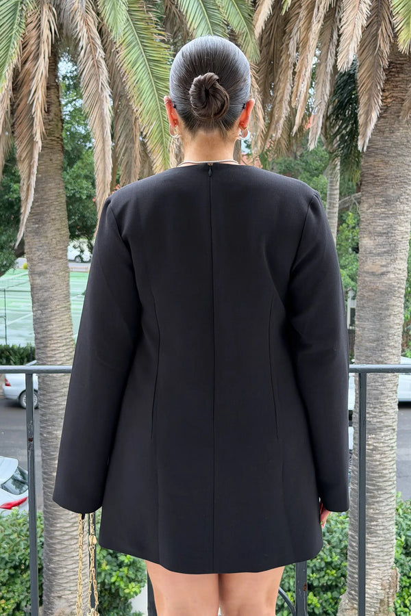 Jaz Suiting Long Sleeve Mini Dress in Black with a deep V neckline and structured fit, creating a sharp, sculpted mini silhouette with a clean, tailored finish.