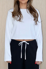 Claudia Long Sleeve Top White by Sneaky Link – Soft cotton-spandex blend, relaxed fit with cropped length. Perfect for viral autumn layering and everyday ease.