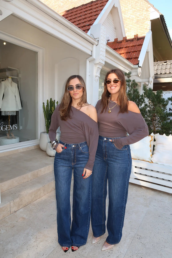 Dee Top by Sneaky Link, off-shoulder top in a soft viscose blend with dolman sleeves and gathered waist for an effortlessly chic look.