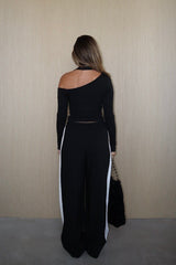 Issy Long Sleeve Top Black by Sneaky Link – Luxuriously soft modal-spandex with an off-shoulder neckline and built-in halter for support. Delicate fabric; handle gently. Cold hand wash.