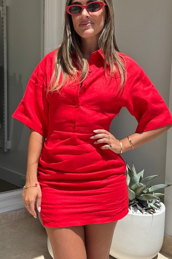 Vida Shirt Dress Red by Sneaky Link – A breathable 100% linen summer essential with boxy sleeves, flattering tucks, and a button front, perfect for sunny days and casual outings.