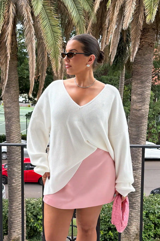 Jaz Oversized V Neck Knit Sweater in White with a deep V neckline and relaxed slouchy fit, creating a soft draped silhouette with a clean, oversized finish.