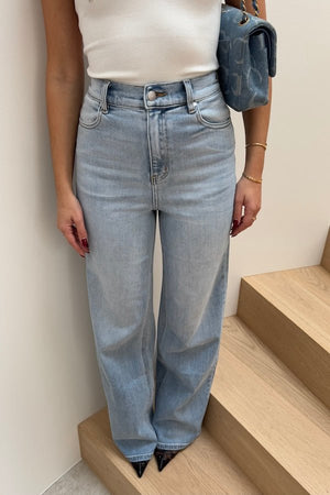 Celine High Rise Stretch Jean Light Blue by Sneaky Link, these flattering jeans feature a subtle flare and a premium stretch cotton blend for comfort and shape retention. Perfect for day to night wear.