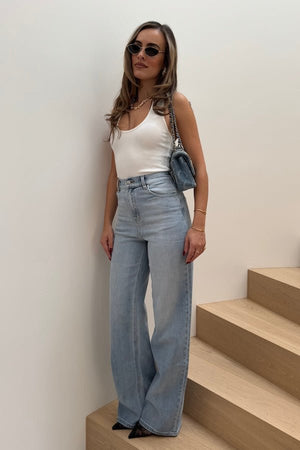 Celine High Rise Stretch Jean Light Blue by Sneaky Link, these flattering jeans feature a subtle flare and a premium stretch cotton blend for comfort and shape retention. Perfect for day to night wear.