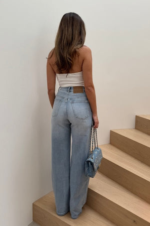 Celine High Rise Stretch Jean Light Blue by Sneaky Link, these flattering jeans feature a subtle flare and a premium stretch cotton blend for comfort and shape retention. Perfect for day to night wear.