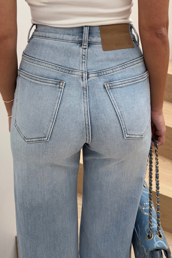 Celine High Rise Stretch Jean Light Blue by Sneaky Link, these flattering jeans feature a subtle flare and a premium stretch cotton blend for comfort and shape retention. Perfect for day to night wear.