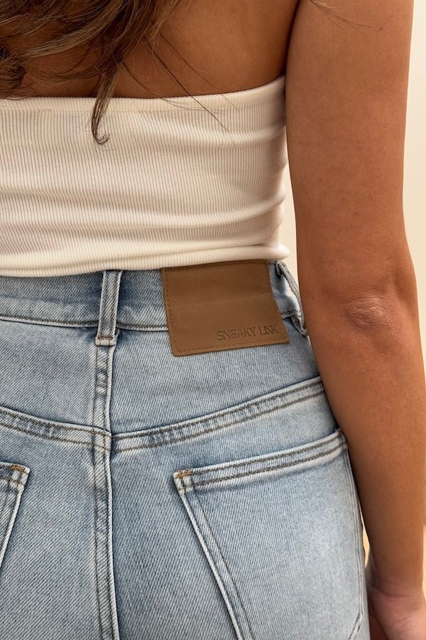 Celine High Rise Stretch Jean Light Blue by Sneaky Link, these flattering jeans feature a subtle flare and a premium stretch cotton blend for comfort and shape retention. Perfect for day to night wear.