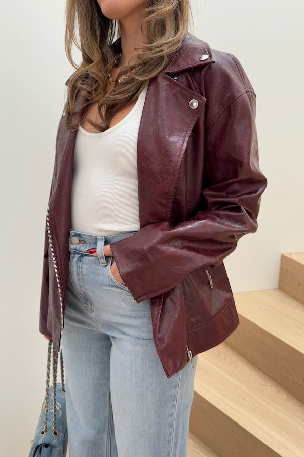 Sia Biker Jacket Burgundy by Sneaky Link — A modern classic in deep burgundy faux leather with croc texture. Oversized fit with signature biker details. Dry clean only.
