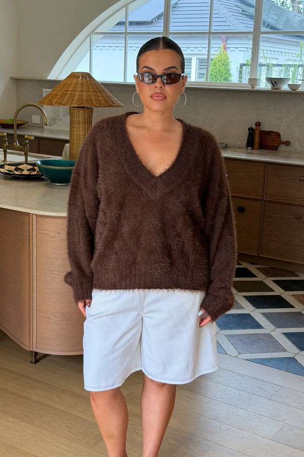 Jaz Fluffy V Neck Knit in Chocolate with a soft fluffy texture, relaxed fit, and deep V neckline creating a cosy, draped silhouette with a warm, elevated feel.