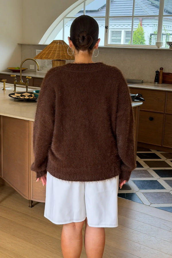 Jaz Fluffy V Neck Knit in Chocolate with a soft fluffy texture, relaxed fit, and deep V neckline creating a cosy, draped silhouette with a warm, elevated feel.