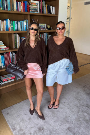 Jaz Fluffy V Neck Knit in Chocolate with a soft fluffy texture, relaxed fit, and deep V neckline creating a cosy, draped silhouette with a warm, elevated feel.