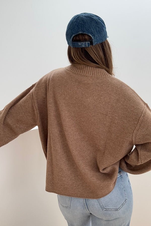 Pia Knit Sweater Beige by Sneaky Link — Soft, cozy wool blend with ribbed neckline, rolled cuffs, and oversized fit. Perfect for layering on cool days.