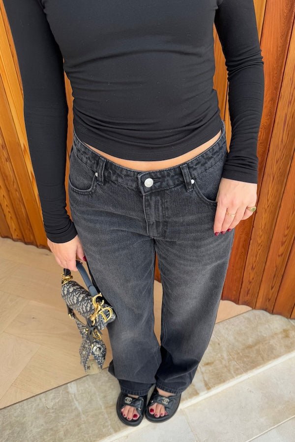 Elisha Baggy Jean Black by Sneaky Link, relaxed mid-rise cotton jeans with branded hardware and signature embroidery. Size down if between sizes.