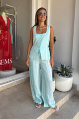 Isla Linen Pant Blue Stripe by Sneaky Link, lightweight linen pants with a relaxed fit and hand-painted stripes, perfect for chic summer days.