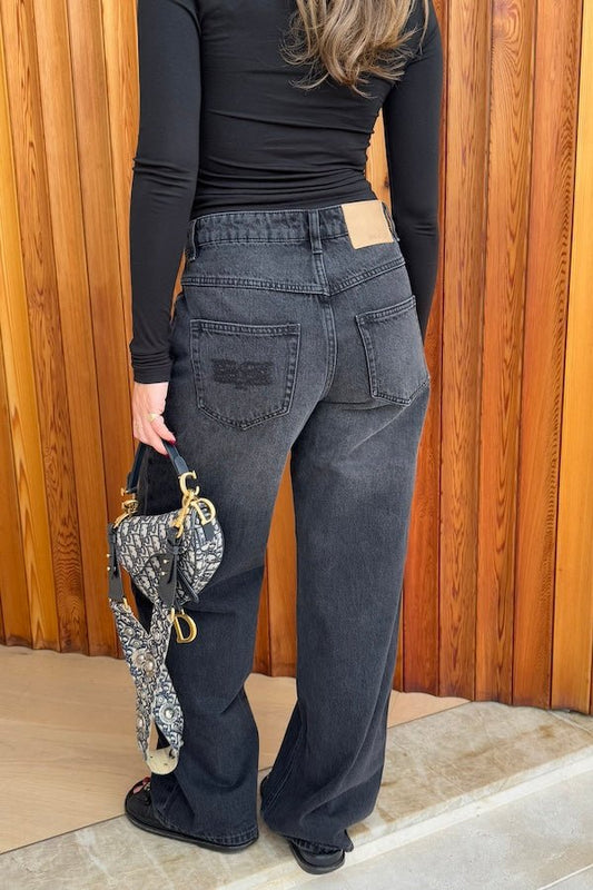 Elisha Baggy Jean Black by Sneaky Link, relaxed mid-rise cotton jeans with branded hardware and signature embroidery. Size down if between sizes.