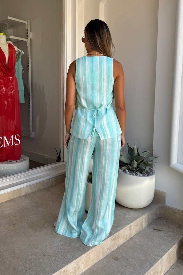 Isla Linen Pant Blue Stripe by Sneaky Link, lightweight linen pants with a relaxed fit and hand-painted stripes, perfect for chic summer days.