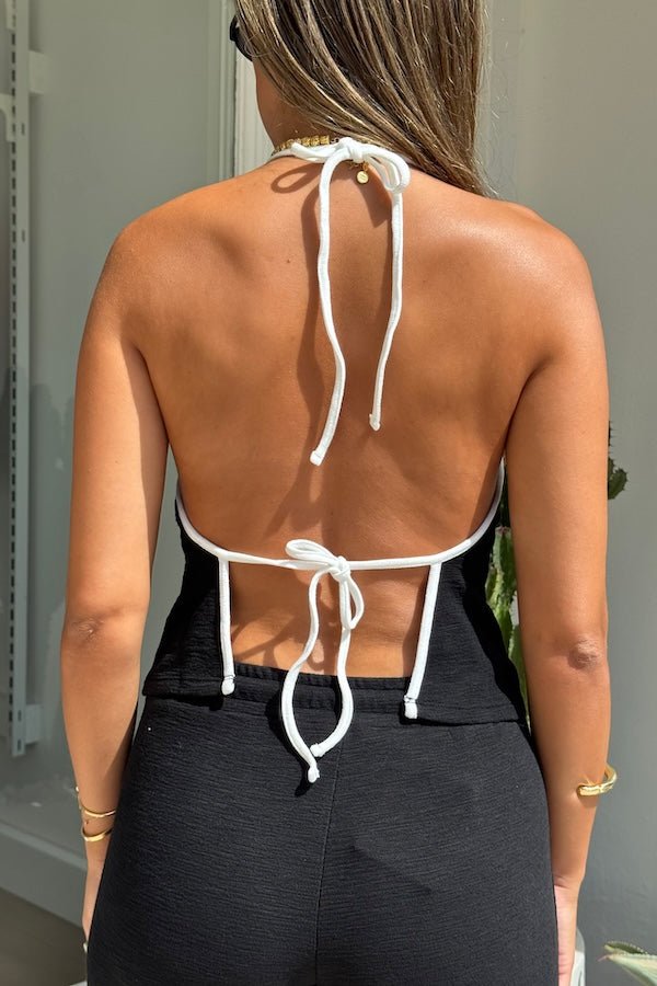 Charlie Halter Top Black/White by Sneaky Link - Trendy summer staple with chic halter neckline and open back. Perfect for beach days or viral nightlife vibes.