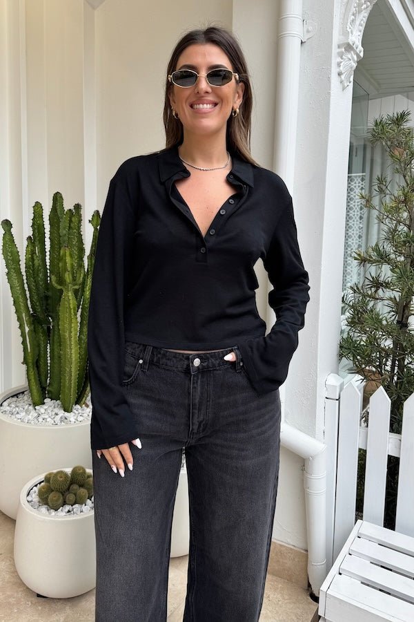 Anya Long Sleeve Top Black by Sneaky Link — Soft knit blend with a relaxed fit, classic collar, and button neck opening. Perfect for layering or pairing with denim. Dry clean only.