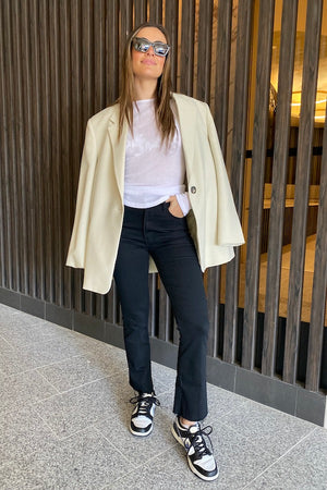 The Hustler Ankle Fray Jeans Not Guilty by MOTHER, vintage-inspired high-rise cropped bootcut in classic black denim, perfect for trendy casual looks.