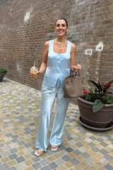 Maja Vest Blue by Sneaky Link – Trendy double-lined satin vest with a chic square neckline and adjustable drawstring back, perfect for polished day or night looks.