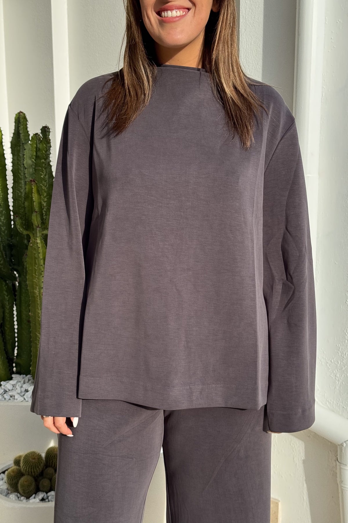 Elanora Long Sleeve Lounge Top Amethyst by Camilla and Marc – Soft high-neck lounge top with side splits, silicone monogram, and blind hems.