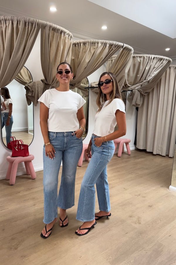 Claudia Baby Tee White by Sneaky Link – A relaxed, cropped tee crafted from a soft viscose-spandex blend for comfort and stretch. Perfect casual chic with short sleeves.