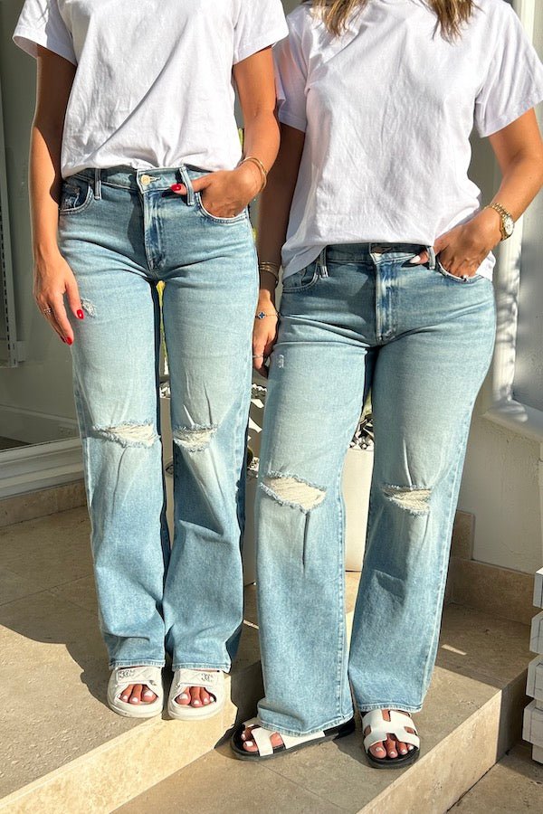 Mid Rise Maven Sneak Peak A Boo by Mother Denim, mid-rise relaxed wide-leg jeans with distressed knees, light-blue wash, perfect for casual cool style.