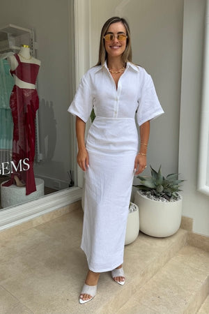 Lefka Midi Dress White by Sneaky Link – Breezy 100% linen midi with button-front and flattering tucks. Perfect for trendy summer strolls or viral lunch dates.