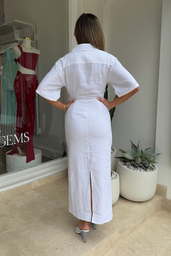 Lefka Midi Dress White by Sneaky Link – Breezy 100% linen midi with button-front and flattering tucks. Perfect for trendy summer strolls or viral lunch dates.