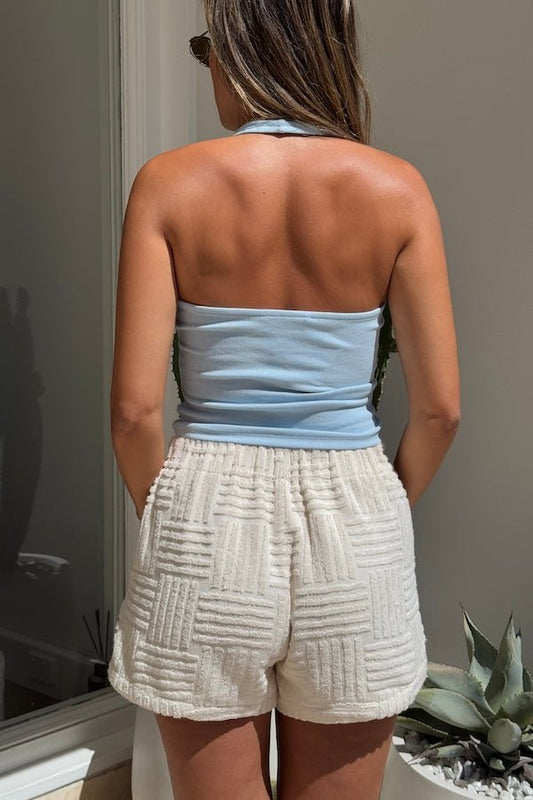 Bella Halter Tank Blue by Sneaky Link – A trendy, breathable cotton-spandex tank with a deep scoop neckline and open back, perfect for layering or solo style.