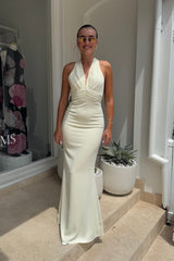 The Ultimate Muse Tie Neck Maxi Dress Butter Cream by Odd Muse – A viral bridal favorite featuring a flattering V-neck, draped shoulders, and elegant low back, perfect for all-night celebrations.