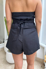 Luna Linen Vest Black by Sneaky Link – Chic 100% linen halterneck vest with adjustable tie neck and back, elasticated detail, and front buttons, perfect for stylish summer layering with shorts, skirts, or denim.