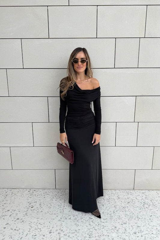 Hunter Maxi Skirt Black by Sneaky Link – Flattering gathered waistband and flared hem create a graceful silhouette. Perfect for trendy day-to-night viral style.